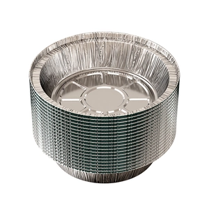 Stack of round thick aluminum foil pans for air fryers on a clean white background