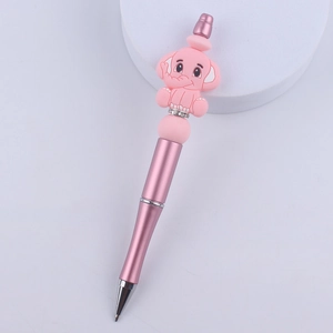 Pink metal ballpoint pen with cartoon elephant silicone bead and rhinestone accents