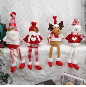 Detailed view of four festive Christmas gnomes with long legs in a cozy home setting