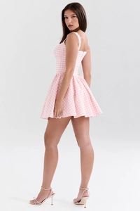 Detail of pink and white checkered mini dress with delicate white lace trim on the neckline