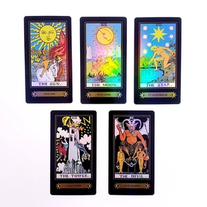 Detail showing holographic tarot cards with The Sun and Moon in shimmering laser finish
