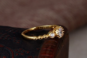 Detail of S925 silver stamp inside the hollow lace crown ring with zircon setting
