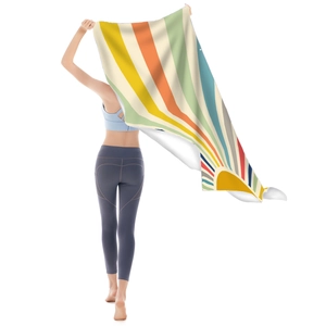 Macro detail of the colorful sunburst microfiber beach towel with lightweight fabric texture