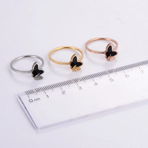 Three-piece set of butterfly open rings in gold, silver, and rose gold with matte finish