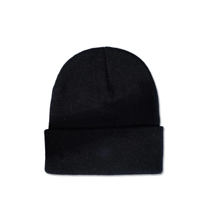Detailed close-up of the black cuffed beanie showing fine knit texture and warm fabric