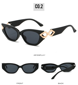Detail der Cateye-Sonnenbrille mit goldenen Hohlrauten-Metallelementen an den Bügeln