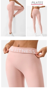 Detail view of pink high waist seamless yoga leggings with side mesh and GYM FITNESS logo