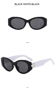 Front and side view of oval black sunglasses with white temples and shell-like inlay