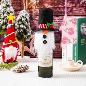 Festive gnome wine bottle cover with a black top hat and white beard in a Christmas scene