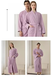 Detail of purple waffle weave bathrobe with white contrast piping and adjustable belt