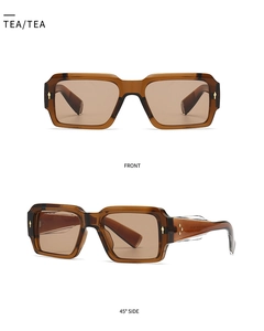 Detail view of retro square tea-colored sunglasses with metallic temple accents