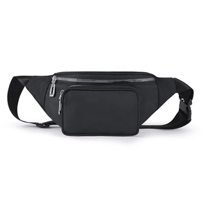 Detail of water-resistant black waist bag featuring multiple zip pockets and metal zippers