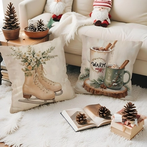 Close-up of linen Christmas cushion covers with Warm Cozy and Let it Snow prints