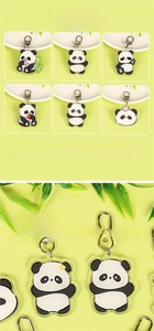 Close-up of cute panda acrylic keychains with various poses and metal hooks for bags