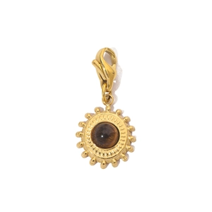 Detail of a gold sun pendant with a dark brown gemstone and a lobster clasp for bracelets