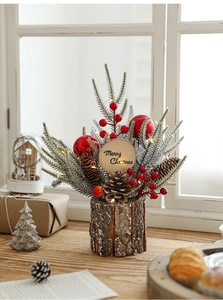 Detail of Christmas table decor with red berries, pine cones and Merry Christmas sign