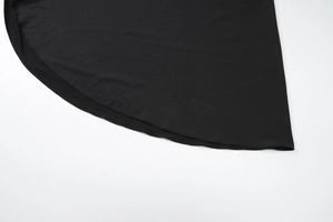 Close-up of the black fabric hem stitching and high-quality texture on the split dress