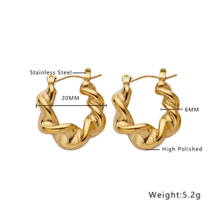 Detail showing 20mm stainless steel golden hoop earrings with twisted texture design