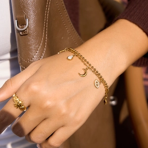 Bracelet en acier doré 18K avec breloques lune, œil maléfique et zircons brillants