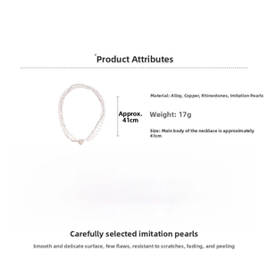 Detail view of multi-layer pearl necklace with a rhinestone-studded heart pendant charm