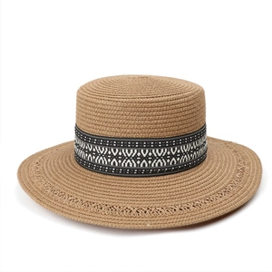 Flat top straw sun hat with bohemian geometric ribbon and woven cut-out brim details