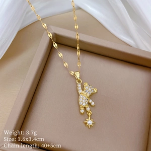 Detailed view of crystal bear pendant with star charm and exact product dimensions