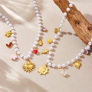 Collana Di Künstliche Perle D'imitazione In Acciaio Inossidabile Placcato Oro Stile Retrò Francese Con Pendenti Multipli Cuore Delfino Sole E Orso Per Donna