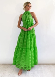 Close-up of green checkerboard pattern on high-end sleeveless halter neck maxi dress