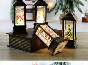 Detail of vintage bronze Christmas lanterns with snowmen and Santa figurines inside