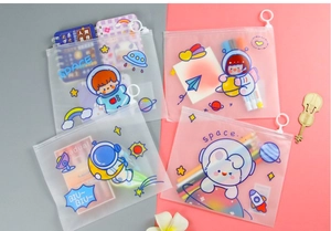 Flat lay of frosted astronaut stationery pouches with round ring zipper and waterproof PVC