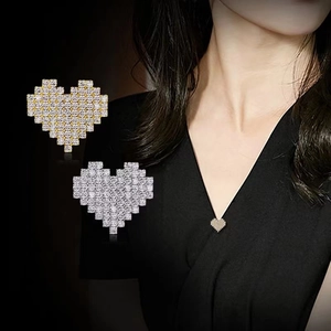 Macro shot of pixelated heart pendant necklace with shimmering zircon inlay detail