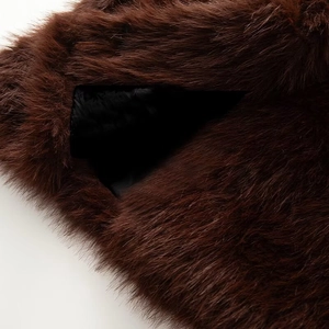 Close-up of deep brown faux fur texture and black inner lining of the fashion vest