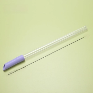 Detail view of the Tritan reusable straw set with taro purple silicone tip and cleaning brush