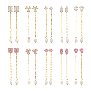 Set of ten gold earrings with geometric cubic zirconia stones and natural freshwater pearls