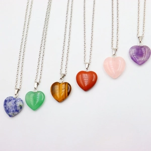 Selection of heart-shaped natural crystal pendants on slim silver chains in various colors