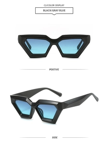 Detail view of black geometric cat-eye sunglasses with gray blue gradient lenses