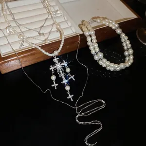 Elegant multi-layer pearl necklace with a diamond-set cross pendant for women