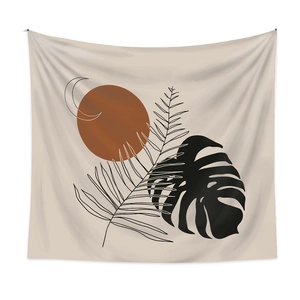 Bohemian tapestry featuring abstract sun, moon, and tropical leaves on beige fabric