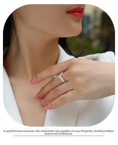 Detail of elegant V-shaped moissanite ring in S925 sterling silver worn by a model