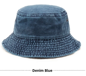 Detailed macro view of denim blue bucket hat with metal eyelets and stitched brim details