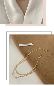 Detail of double-layer 18k gold-plated snake chain and paperclip link necklace set