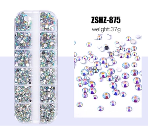 Detailed macro view of 12-slot storage box with colorful flatback nail art rhinestones