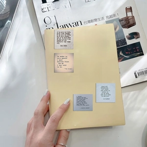 Close-up of minimalist vintage quote stickers on notebook for creative DIY decoration