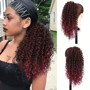 Detail view of curly ponytail hair extension in black to burgundy ombre gradient