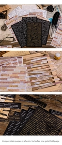Close-up of vintage gold-foiled paper stickers with English phrases for DIY scrapbooking
