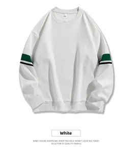 Detail of white crewneck sweatshirt featuring tricolor green and black striped sleeves