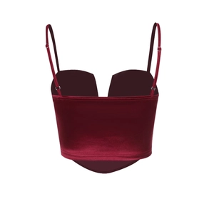 Macro view of burgundy velvet camisole showing V-neckline and adjustable straps