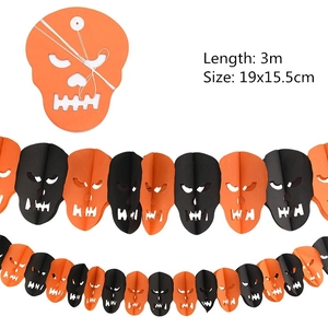 Close-up of 3m Halloween skull paper garland banners in classic orange and black colors