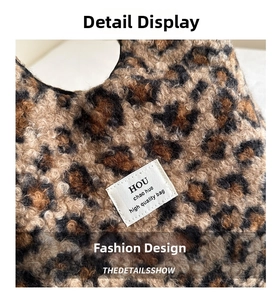 Close-up of leopard print faux fur bag with a stitched minimalist rectangular label