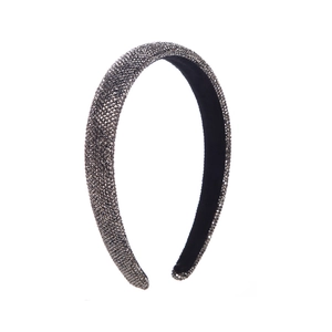 Macro view of grey crystal rhinestones on the thick padded fashion headband
